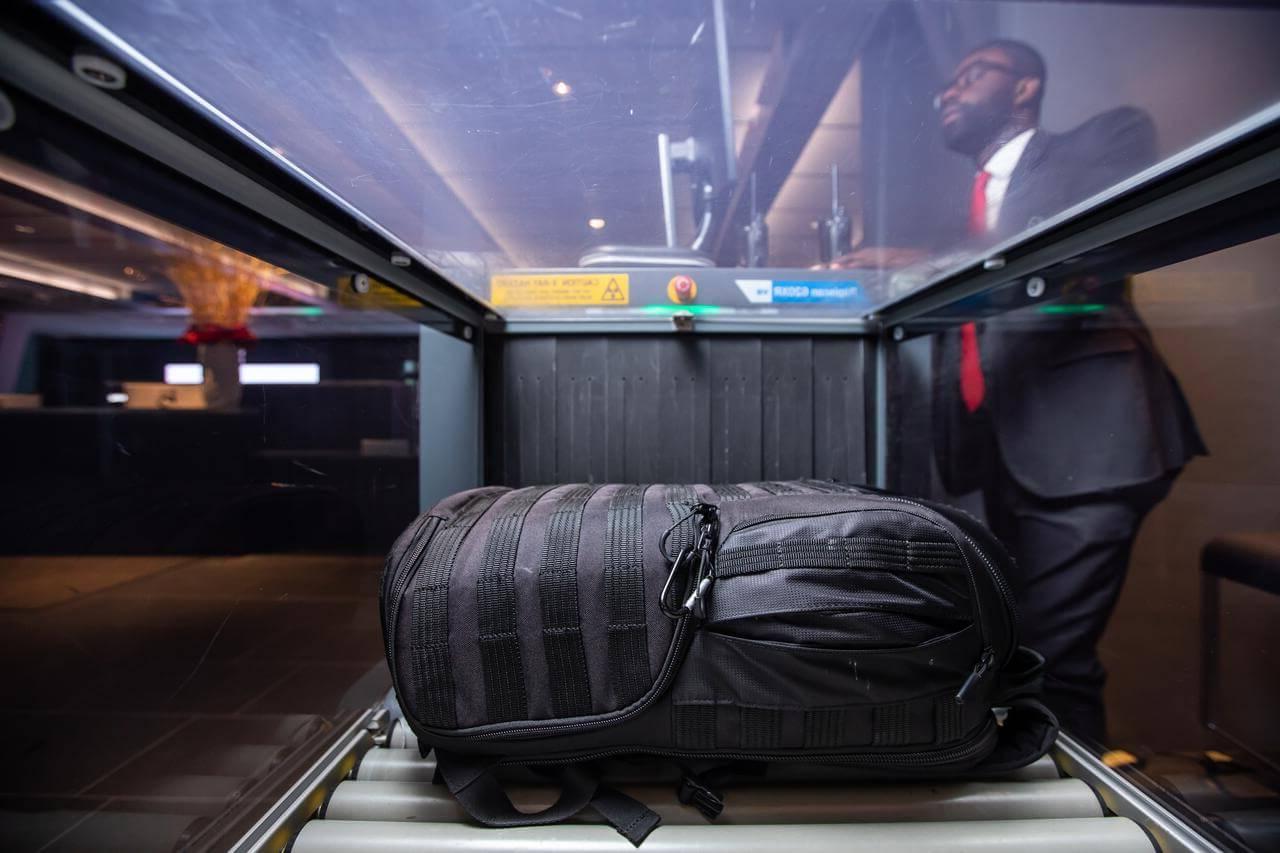 A black bag being inspected in a security scanner